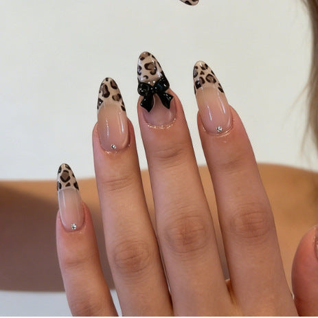 Elegant Leopard Print Stiletto Nails with Bow Embellishments