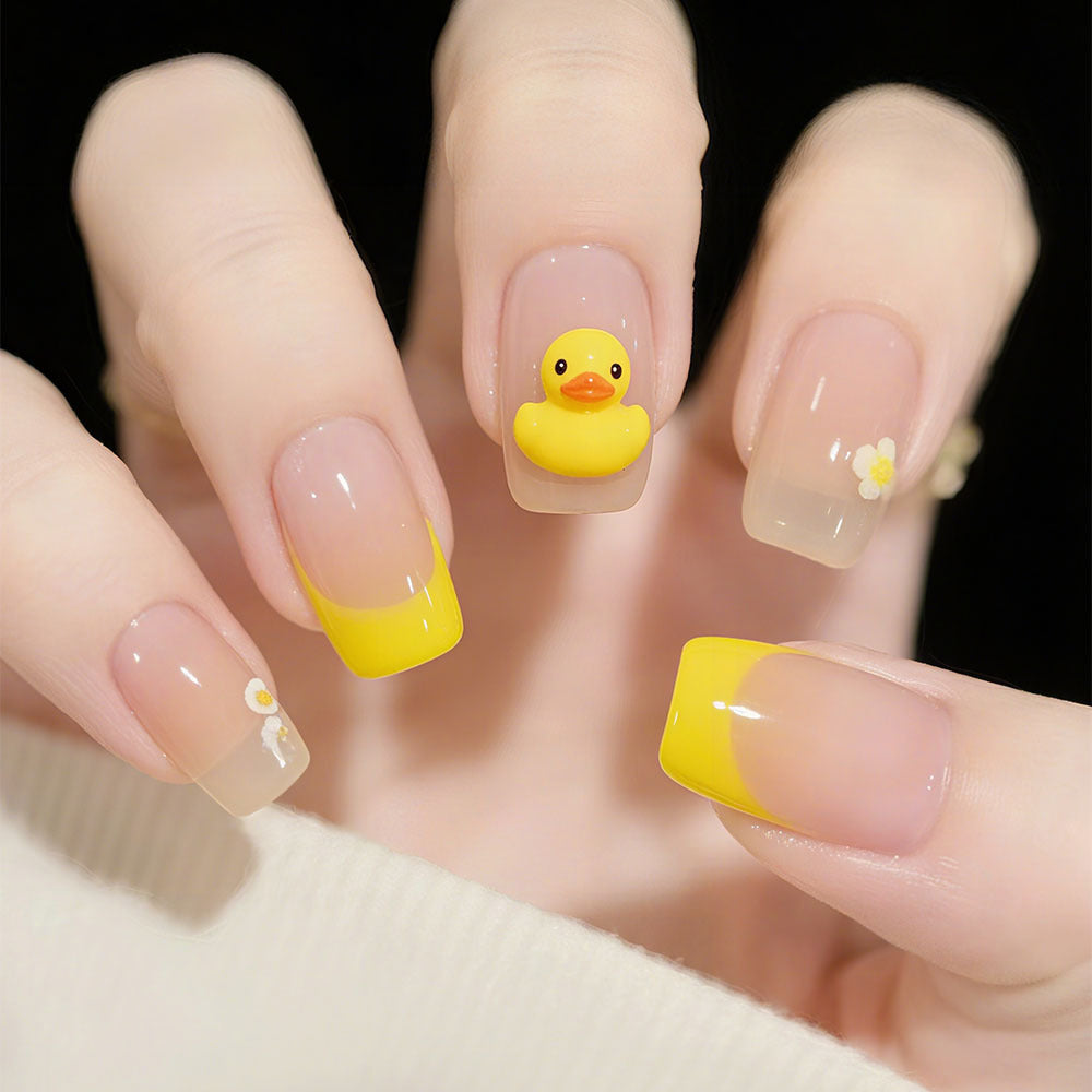 Artificial nails with playful duck motif and spring accents Bowlift