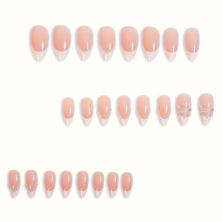 Art nail tips with delicate pearl and butterfly accents Bowlift
