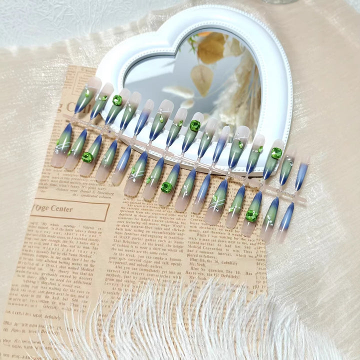 Artificial nails with elegant gradient color and glitter accents Bowlift