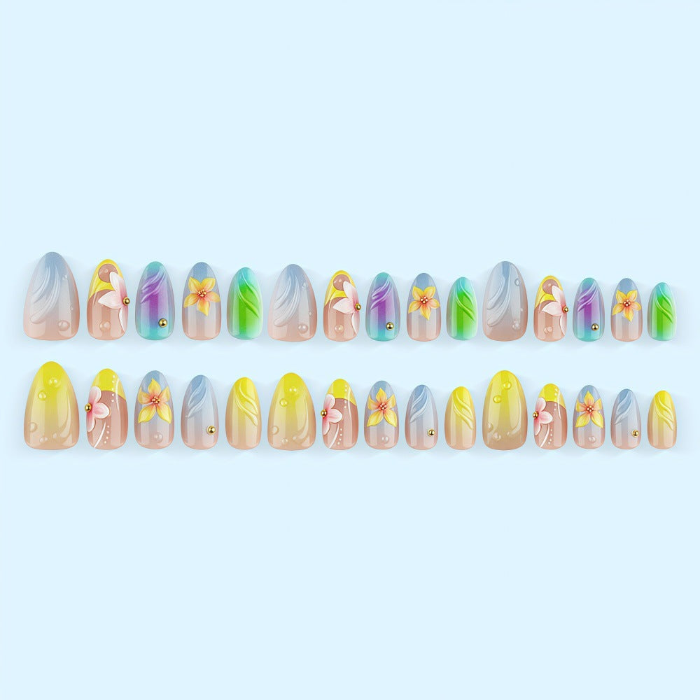 Acrylic nail set with floral elements and colorful accents Bowlift