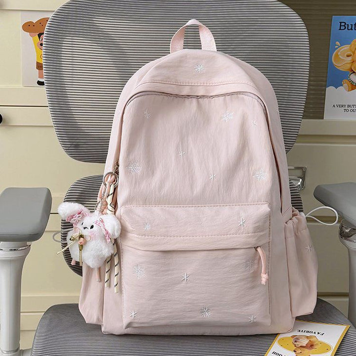 Playful backpack with fine embroidery Bowlift