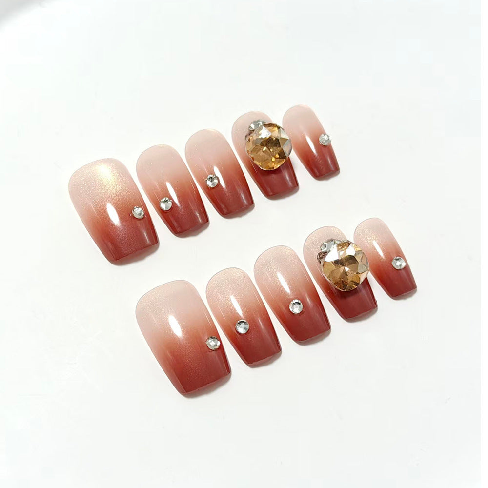 Artificial nail set with glittering rhinestone applications Bowlift