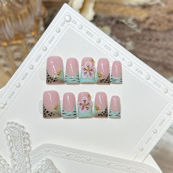 Artistic Press-On Nail Set with Floral and Patterned Design Bowlift