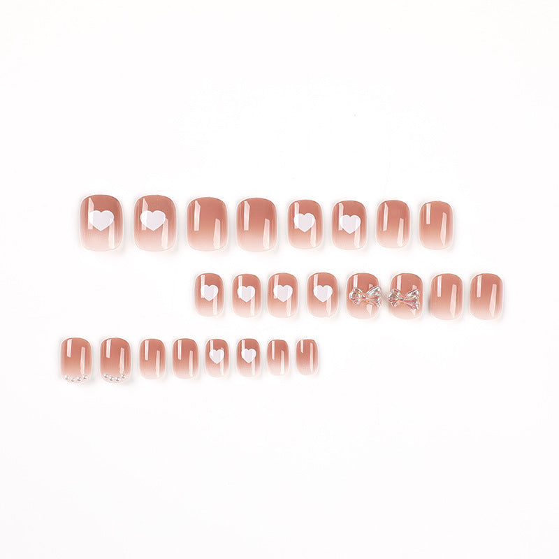 Artificial nails with romantic hearts and glitter accents Bowlift