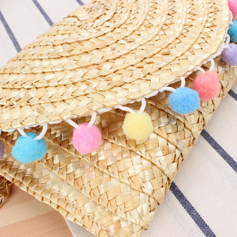 Clutch Bag Made of Handwoven Straw with Decorative Pompons Bowlift