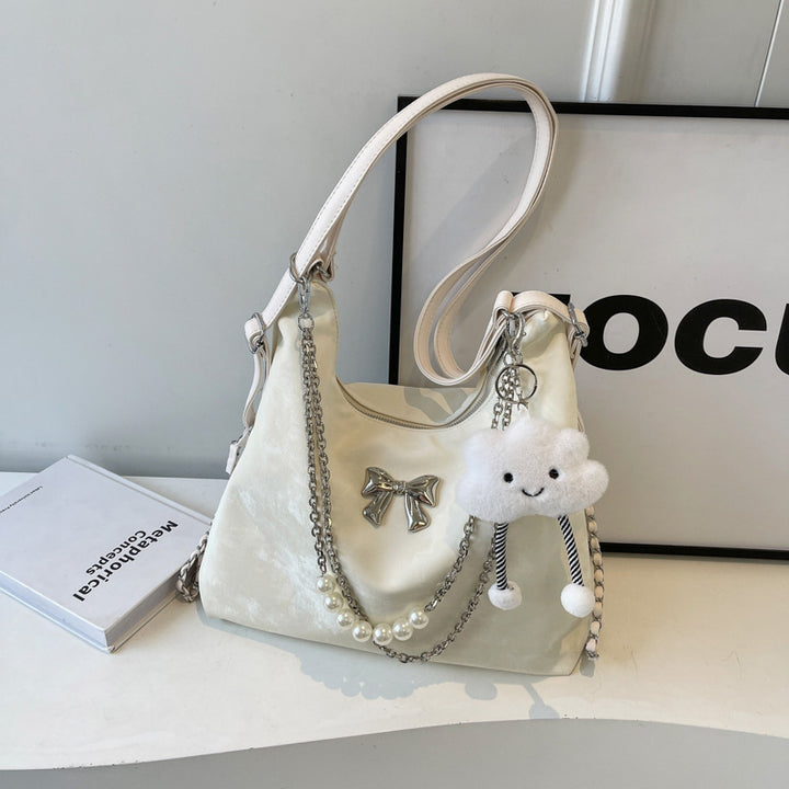 Fashionable handbag with unique pendant and chain accents Bowlift