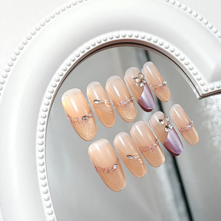 Glamorous artificial nails with rhinestone applications Bowlift
