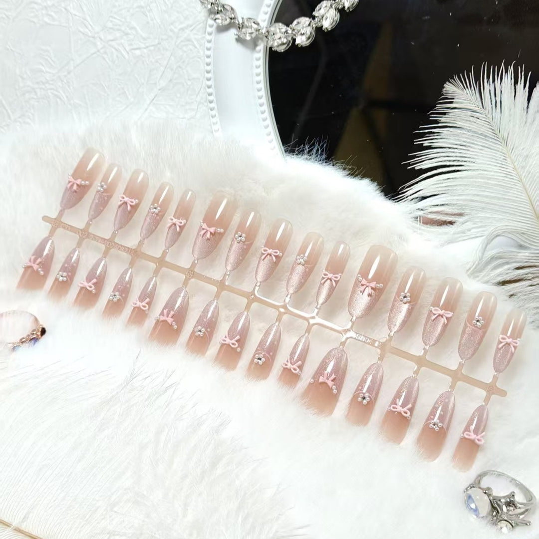 Artificial nails with elegant glitter and bow design Bowlift