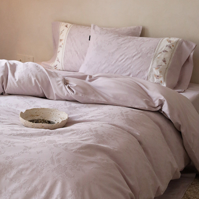 Exclusive cotton satin bedding set with tonal floral jacquard and fine decorative embroidery