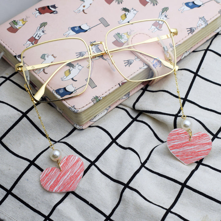 Heart-Shaped Eyewear Chain with Pearl Accents Bowlift