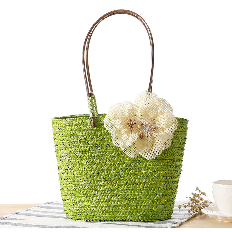 Elegant bast bag with flower appliqué Bowlift