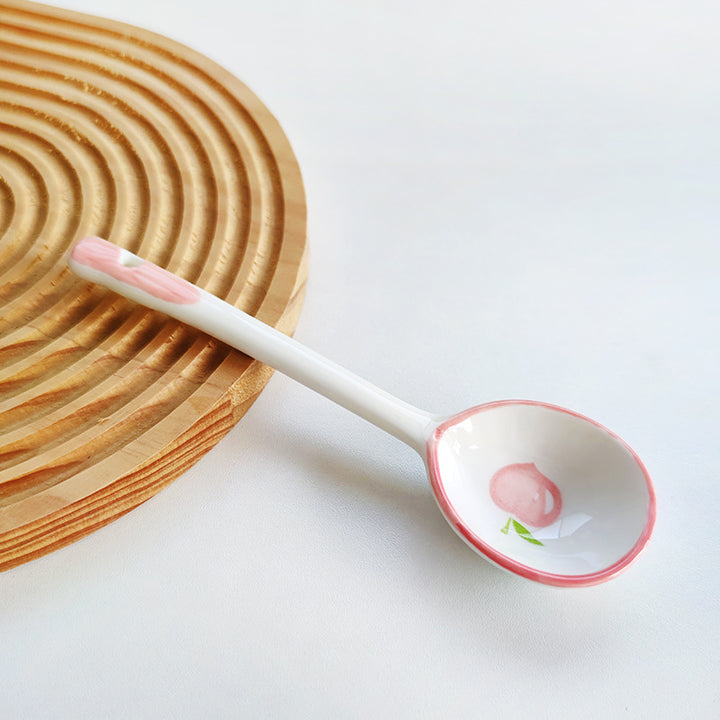 Ceramic soup spoon with lucky cat illustration and ergonomic long-handle Bowlift