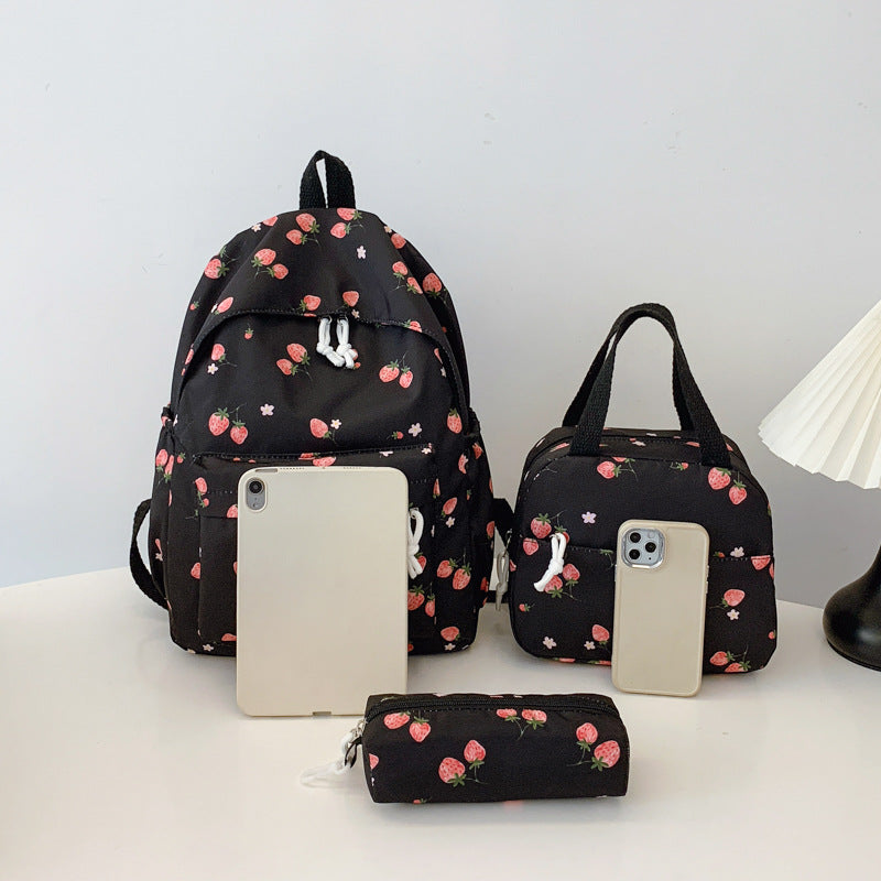 Backpack set with cheerful strawberry pattern and practical compartments Bowlift