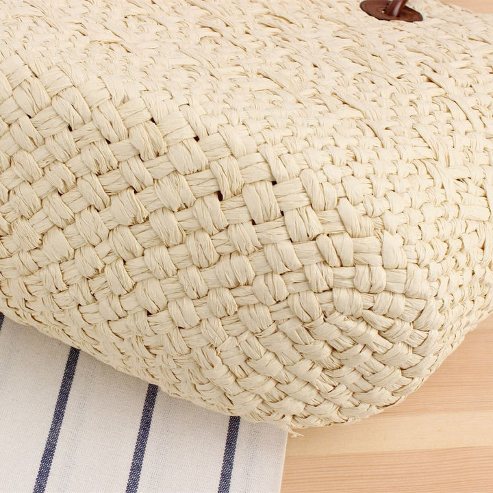 Beach bag made of high-quality braided straw with stylish leather handles Bowlift
