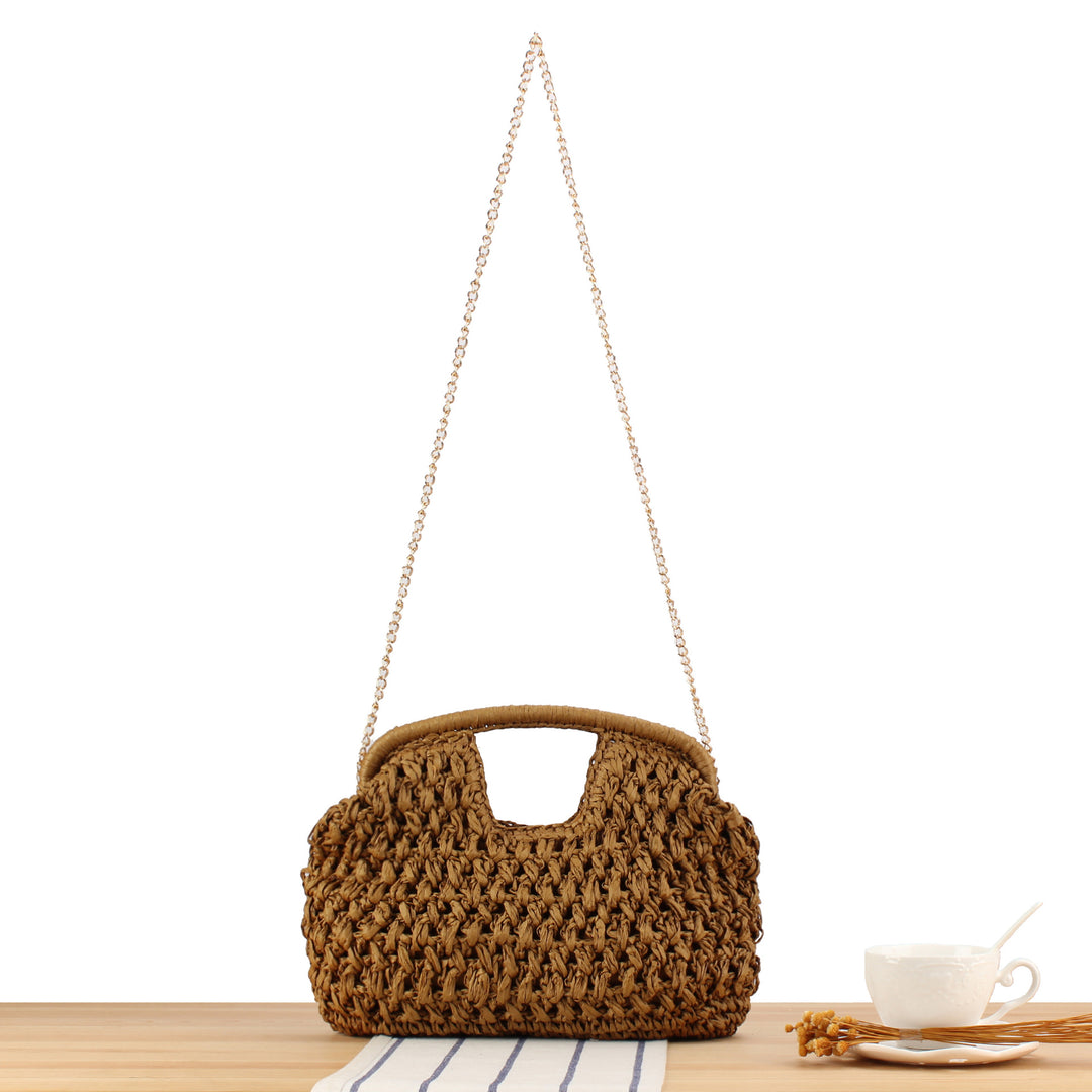 Handbag made of naturally untreated woven material with elegant chain embellishment Bowlift