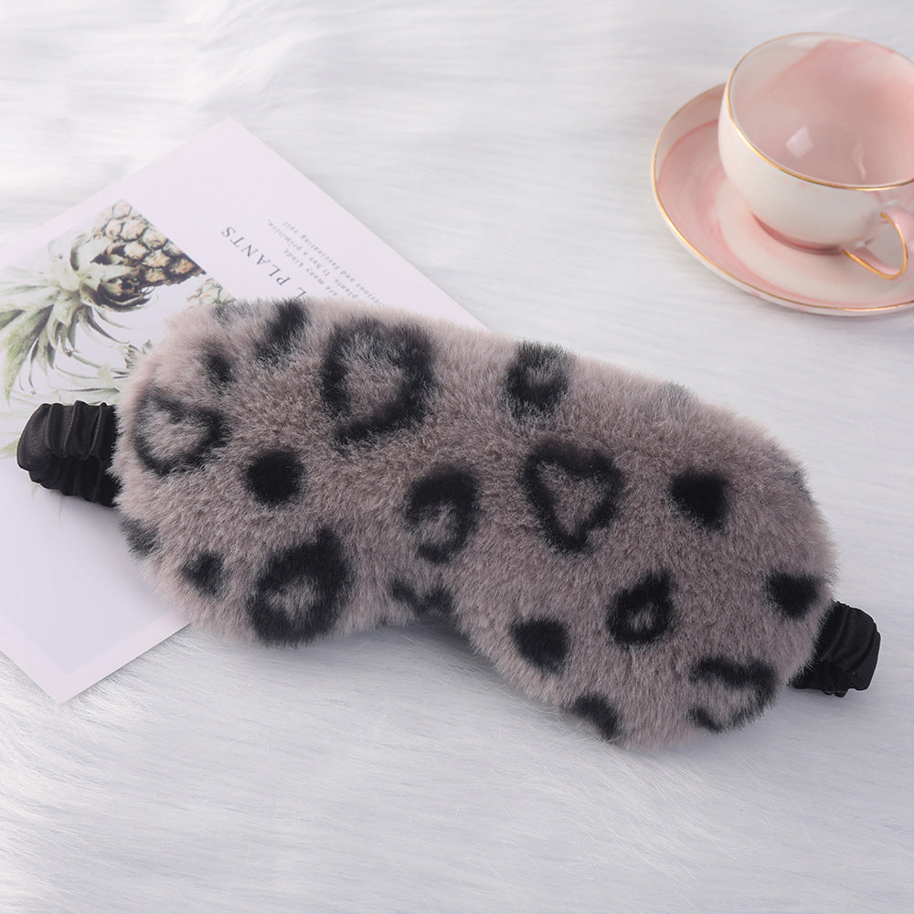 Women's cuddly faux fur sleep mask with heart-embossed surface and gathered comfort band Bowlift