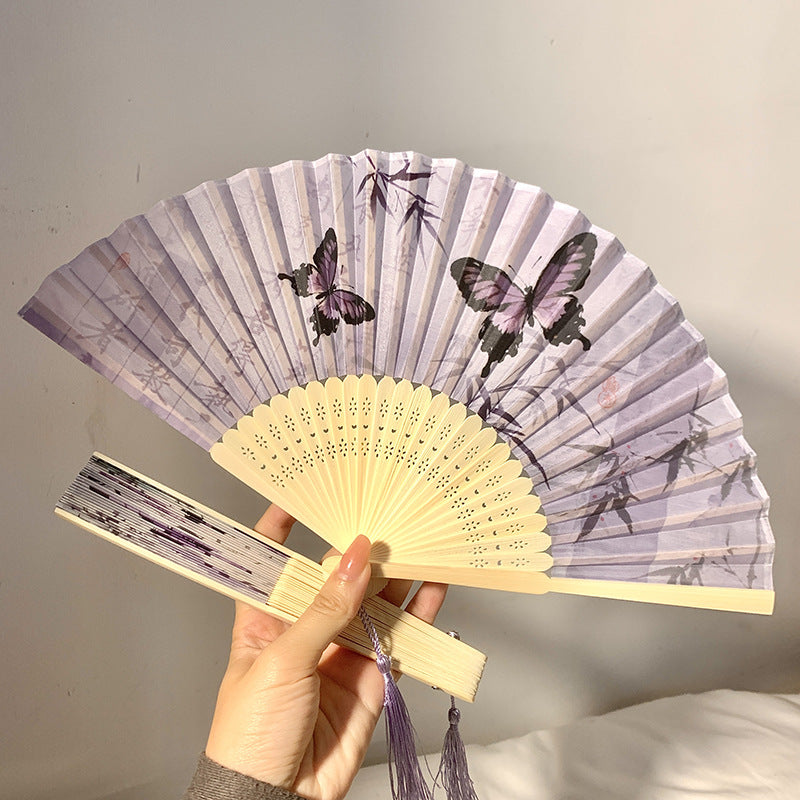 Elegant fan with elaborate butterfly motif Bowlift