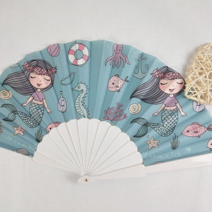 Women folding hand fan with shimmering scale pattern Bowlift