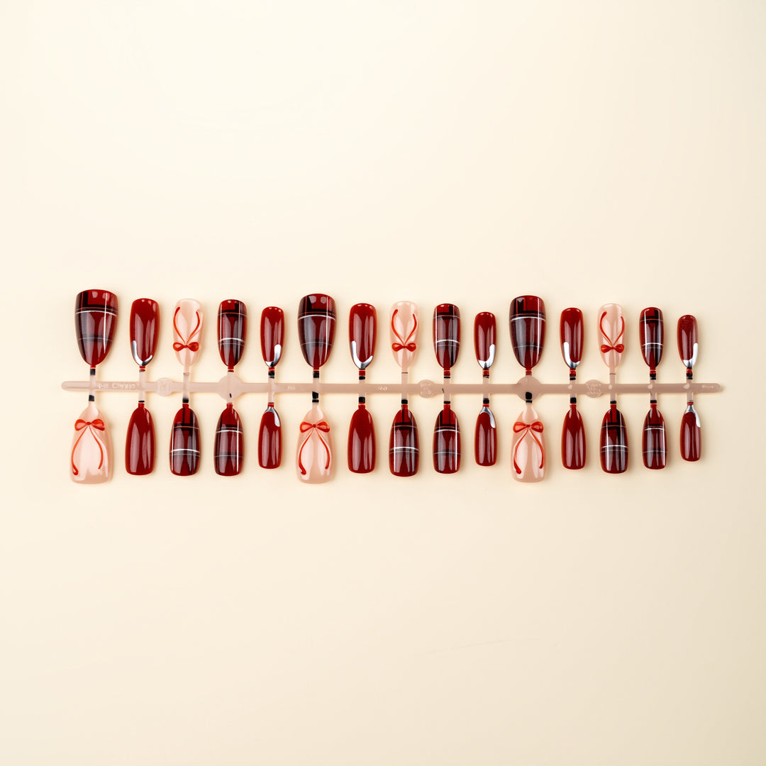 Art nail set with festive design and bow accents Bowlift