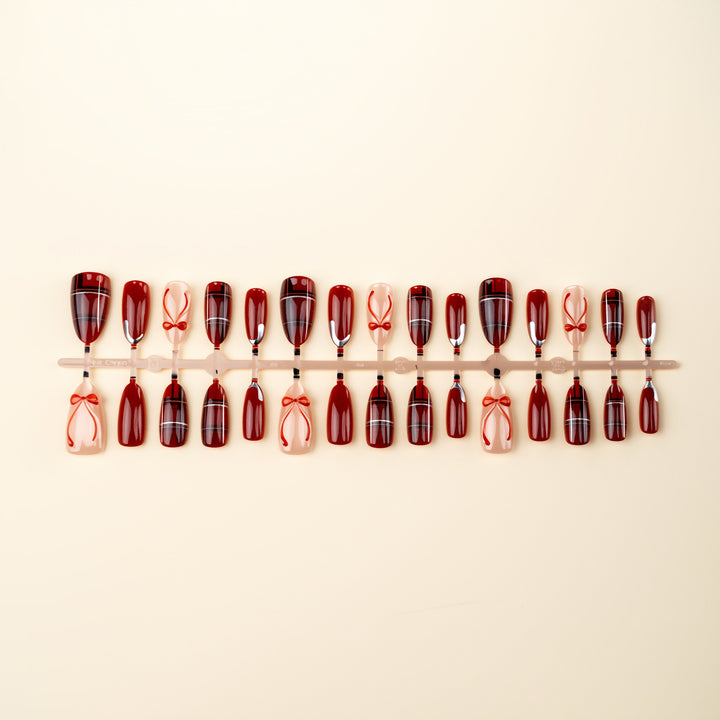 Art nail set with festive design and bow accents Bowlift