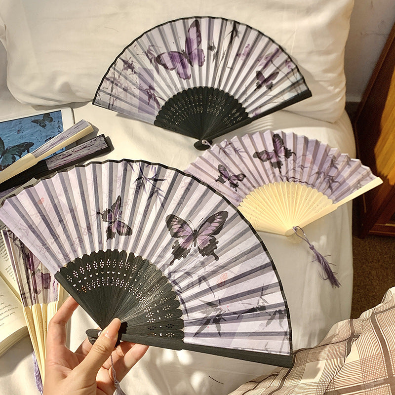 Elegant fan with elaborate butterfly motif Bowlift