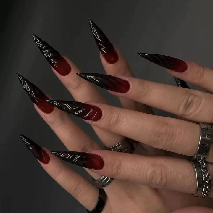 Gothic-style artificial nails with pointed tips and shiny surface Bowlift