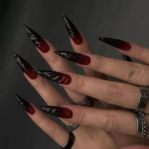 Gothic-style artificial nails with pointed tips and shiny surface Bowlift