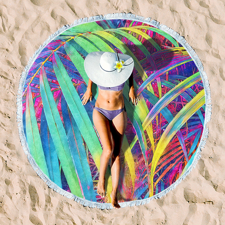 Round beach towel with colorful, tropical floral pattern and fringe decoration Bowlift