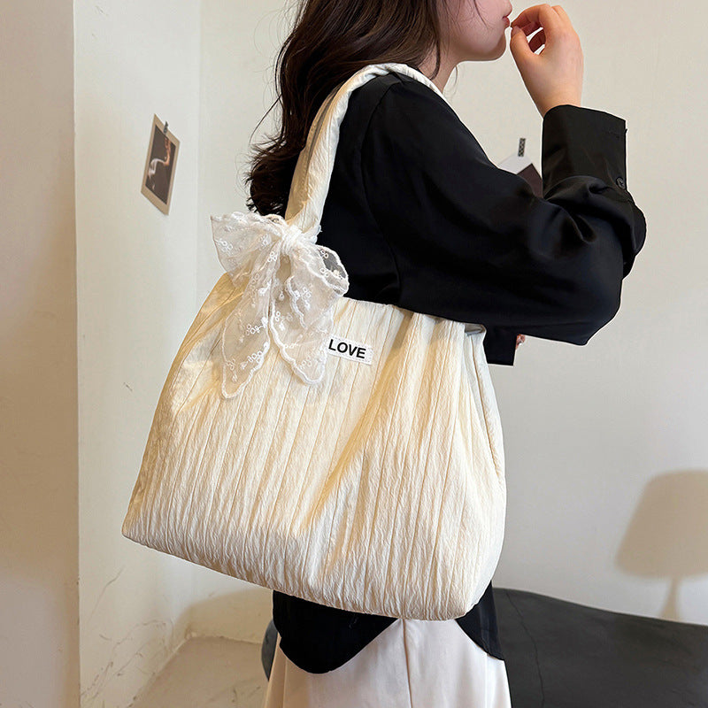 Leisure bag with structured design and playful scarf Bowlift
