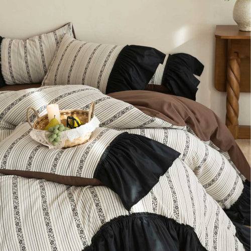 Ruffled duvet cover set with striped jacquard trim and reversible pillow