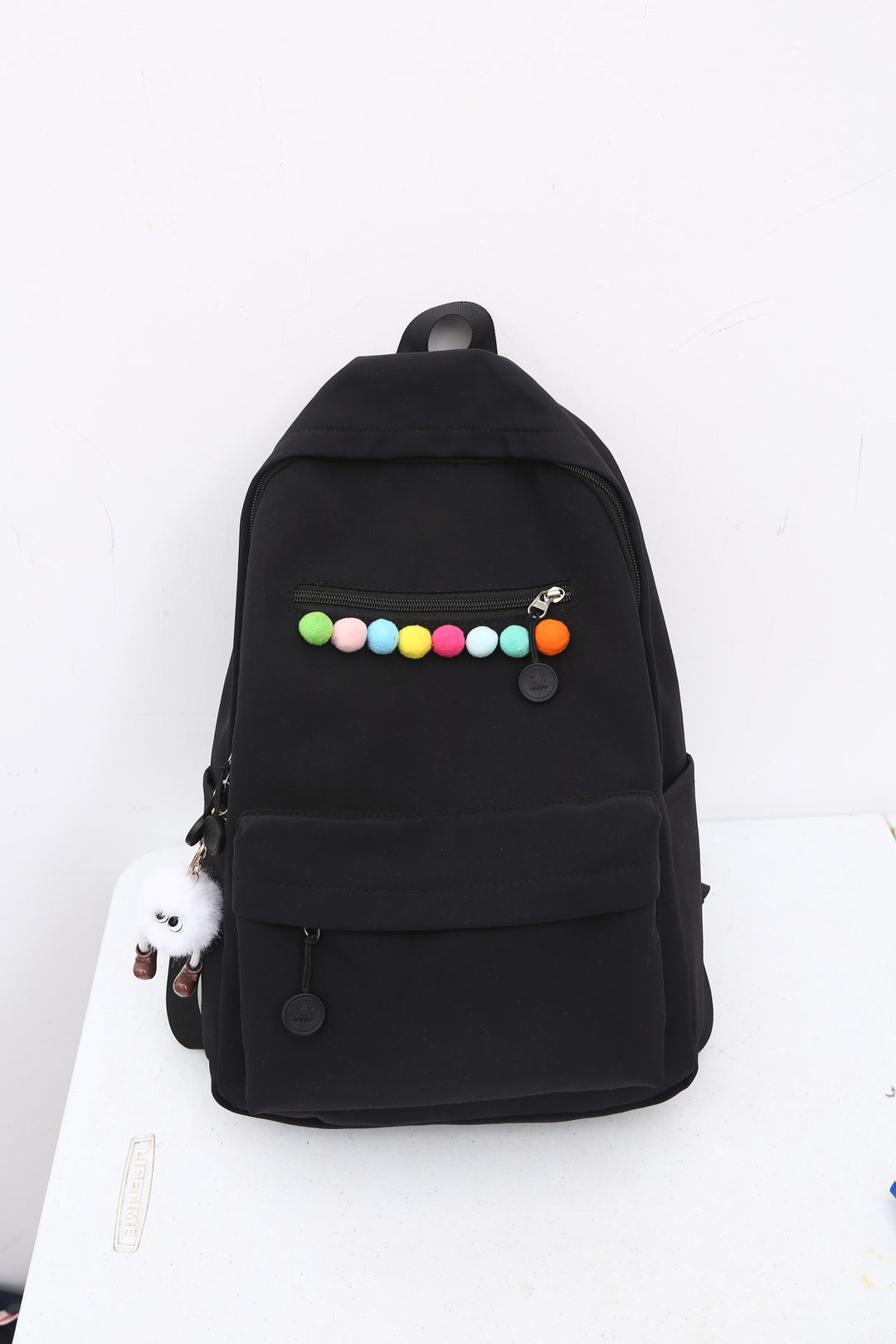 Practical backpack with colorful applications Bowlift