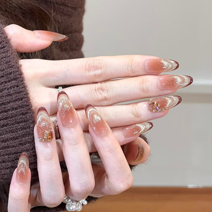 Glamorous art nails with glitter and stone accents Bowlift