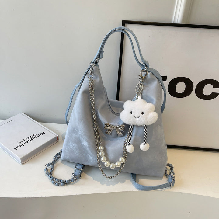 Fashionable handbag with unique pendant and chain accents Bowlift