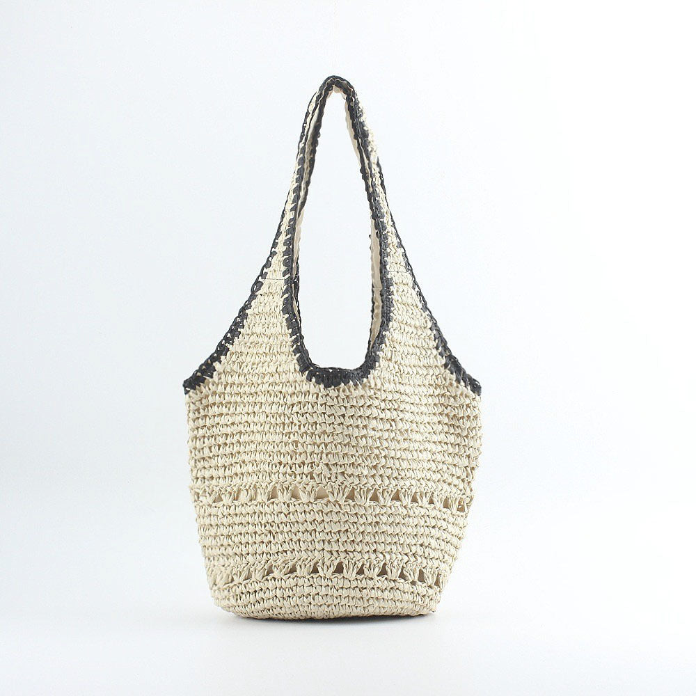 Beach shoulder bag made of hand-woven raffia with elegant lace trims Bowlift