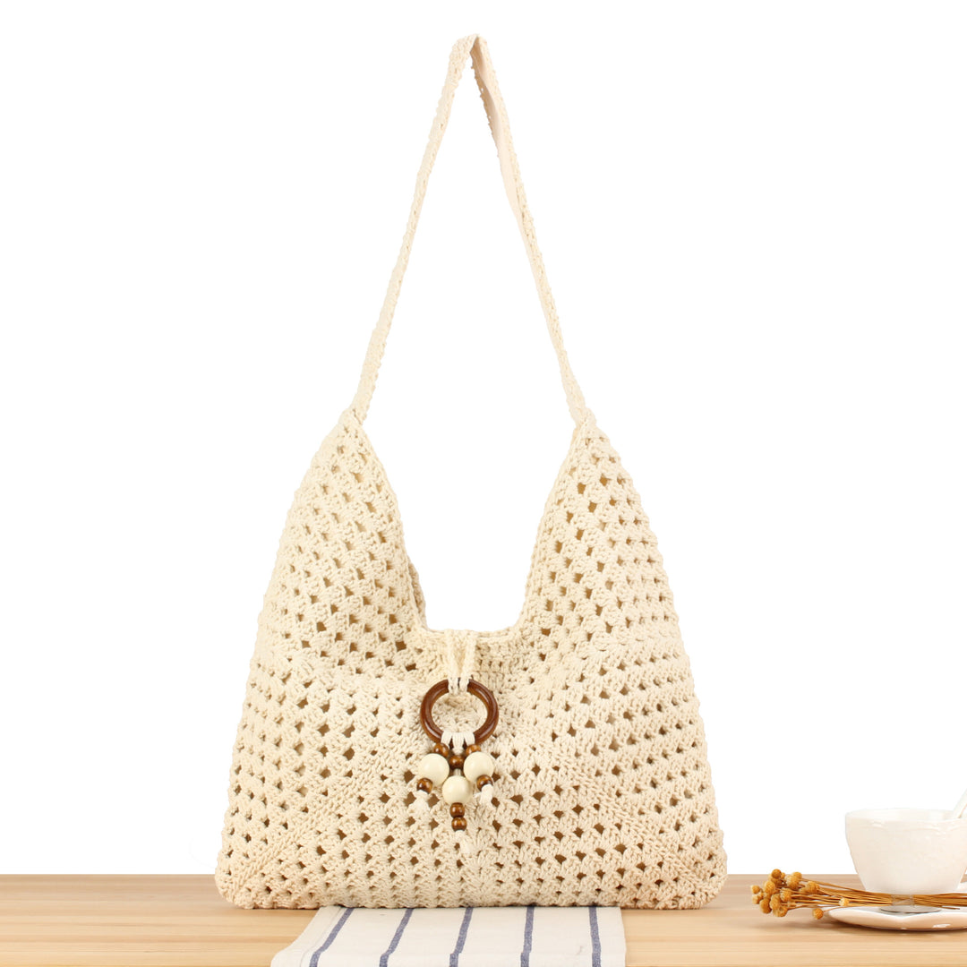 Handbag made of hand-knotted natural material with chic tassel decoration Bowlift