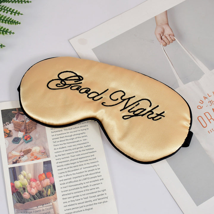 Unisex embroidered contoured sleep mask with decorative text embroidery and adjustable elastic band Bowlift