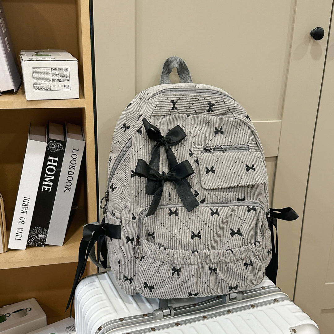 Playful backpack with bow details and practical compartments Bowlift