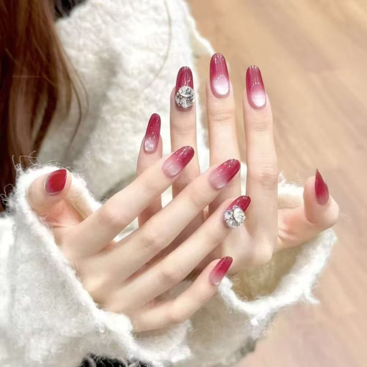 Artistic Long Stiletto Press-On Nails with Floral and Gemstone Accents Bowlift