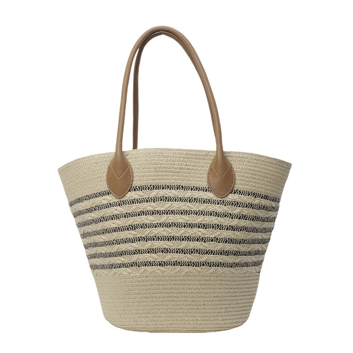 Beach bag made of natural woven material with elegant accents Bowlift