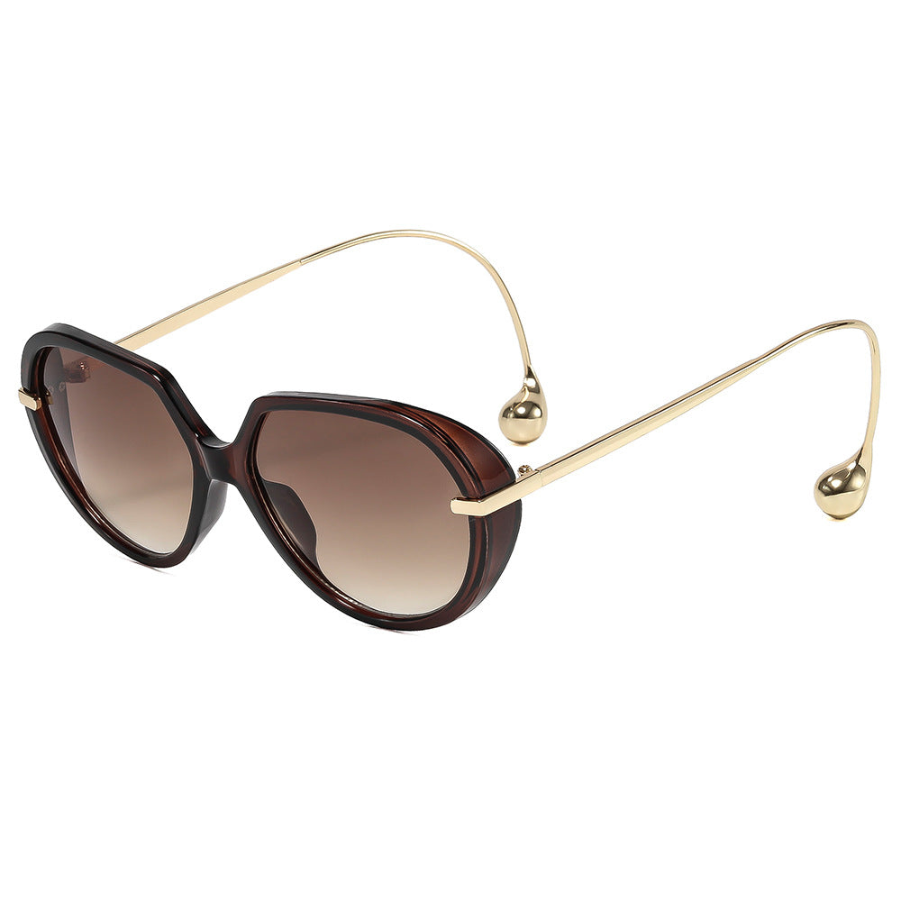 Women's Cat-Eye Sunglasses with Golden Accents and Stylish Frame Bowlift