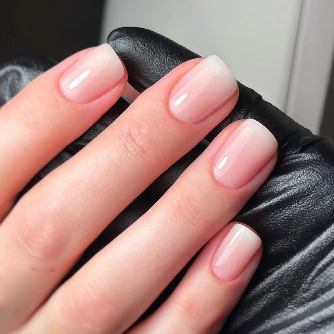 Artificial nails in elegant French tip design Bowlift