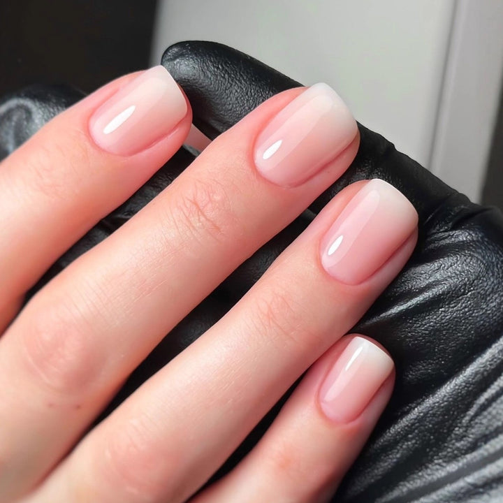 Artificial nails in elegant French tip design Bowlift