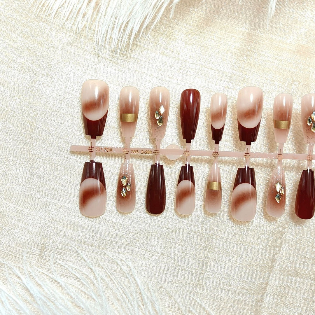 Artificial nails with elegant color gradients and jewelry details Bowlift