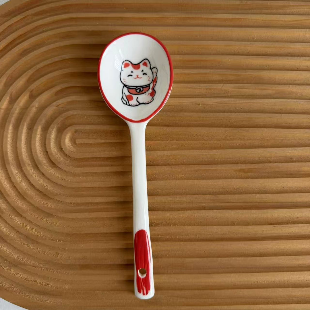 Ceramic soup spoon with lucky cat illustration and ergonomic long-handle Bowlift