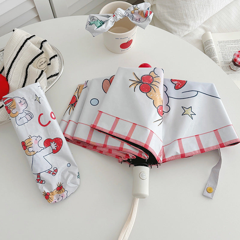 Ladies folding umbrella with playful children's motif Bowlift