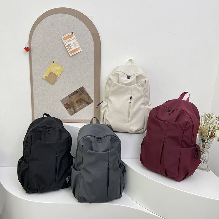 Backpack with Versatile Compartments and Charming Pendant Bowlift