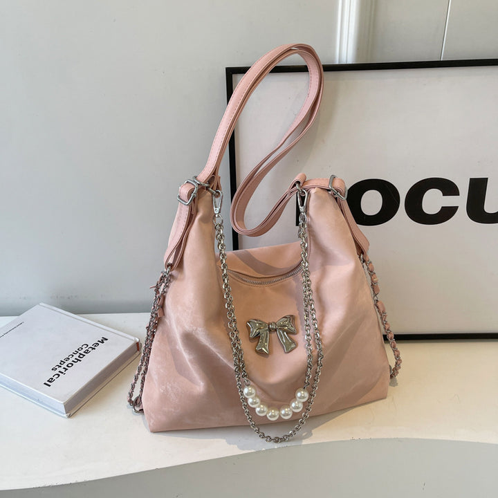 Fashionable handbag with unique pendant and chain accents Bowlift