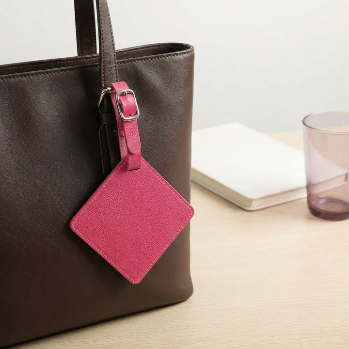 Premium leather luggage tag with adjustable buckle strap and protective ID card sleeve Bowlift