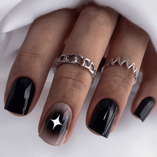 Artificial nails in elegant black with gloss and creative accents Bowlift